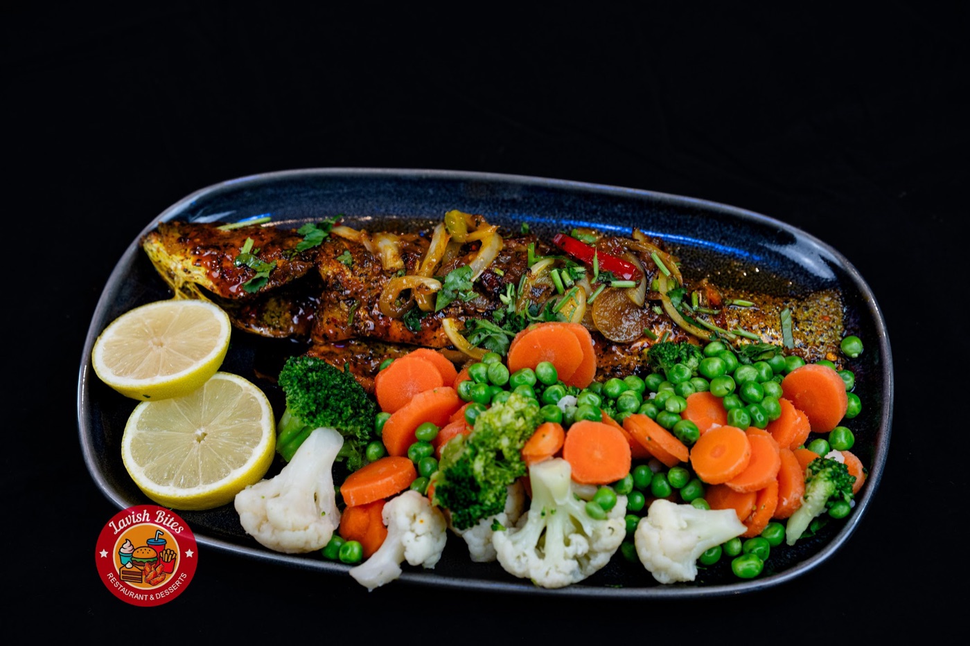 Chargrilled marinated fish topped with onions and chilli, served with steamed carrots, peas, broccoli and cauliflower
